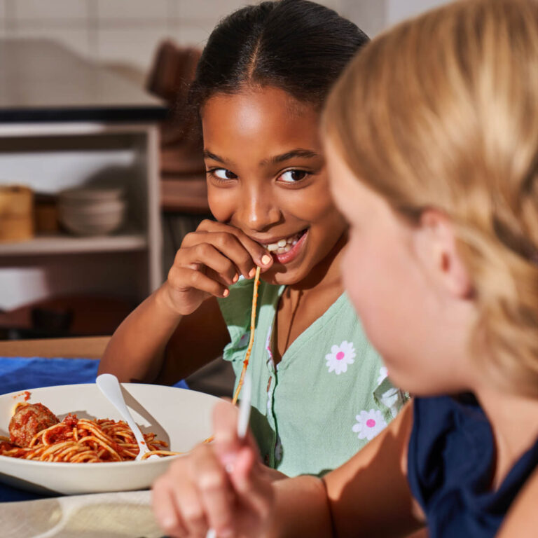 Kids Smiling Laughing Eating Spaghetti And Meatballs