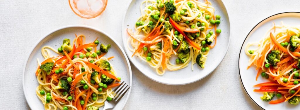 Gluten free spaghetti pasta on plate with vegetables